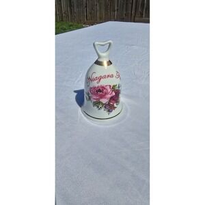 Niagara Falls souvenir bell is ceramic & decorated with pink roses and gold trim